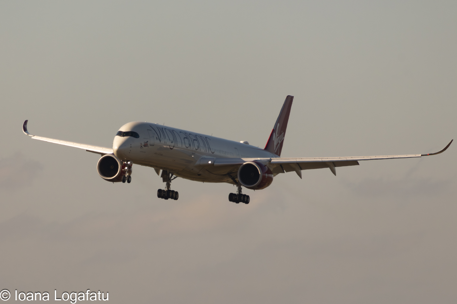 Aircraft landing at sunset
